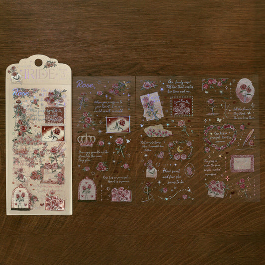 Decorative sticker sheets with floral and text designs on a wooden surface