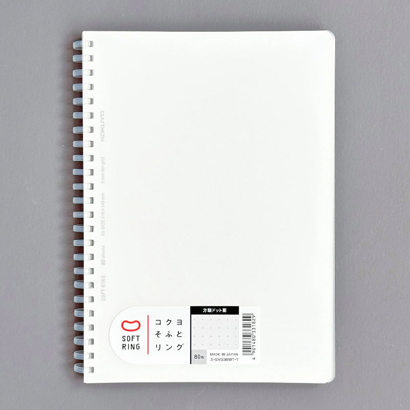 White notebook with spiral binding on a gray background