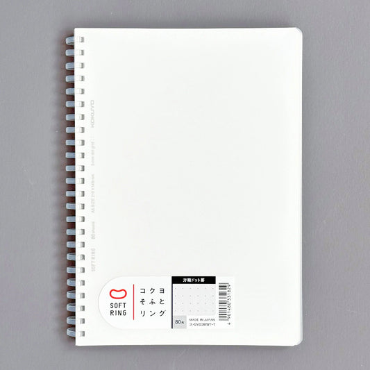 White notebook with spiral binding on a gray background